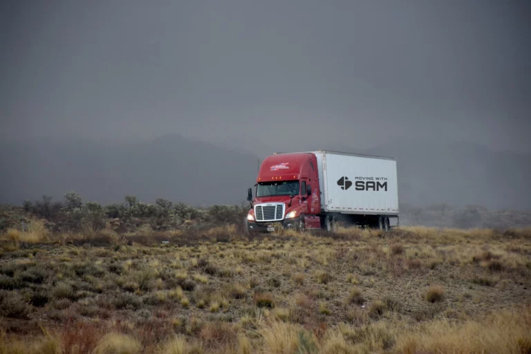 A Moving with Sam truck on an open road