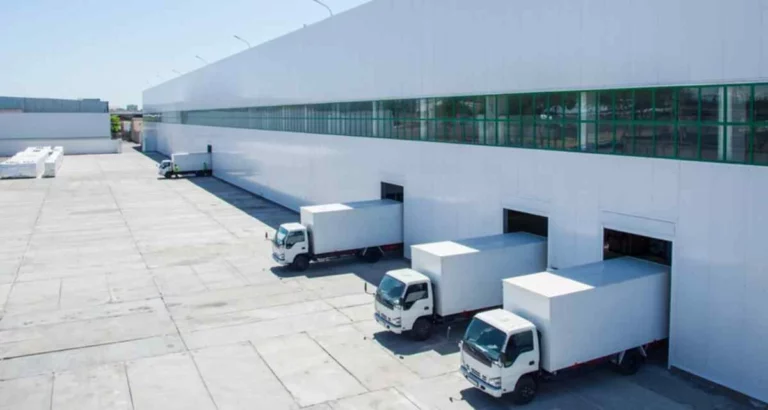 Moving with Sam trucks at a loading dock