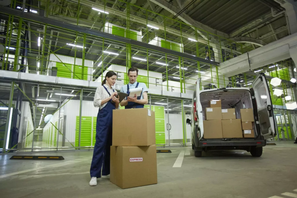 A warehouse team loading a delivery van