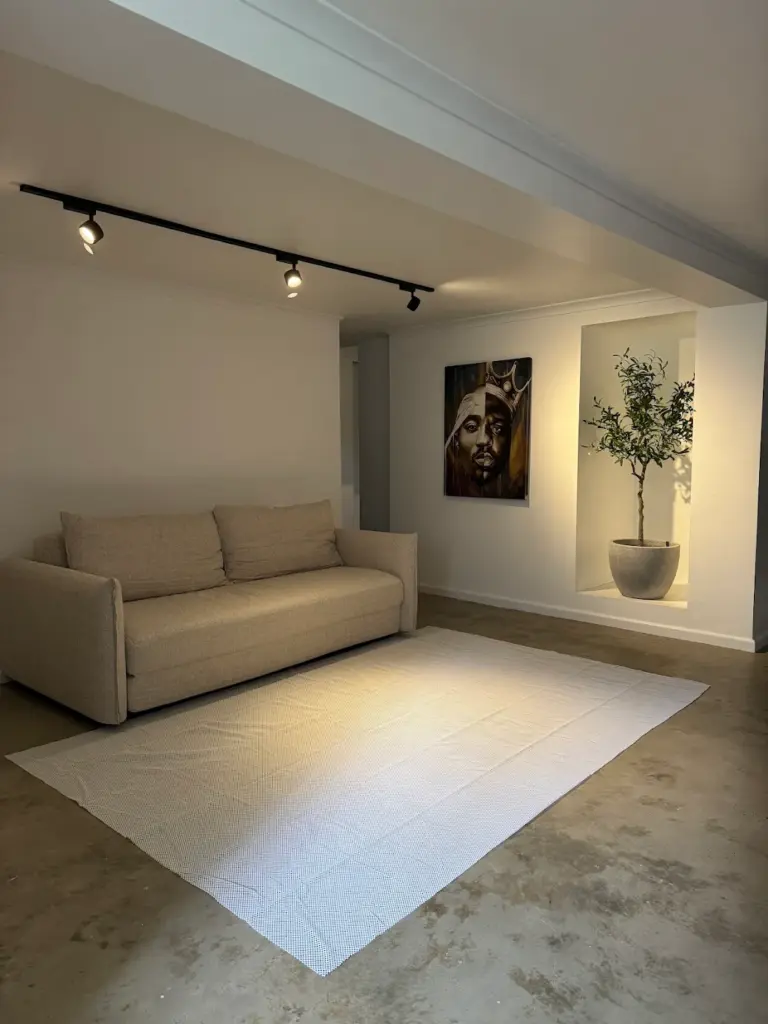 A sofa placed in a bright lounge room