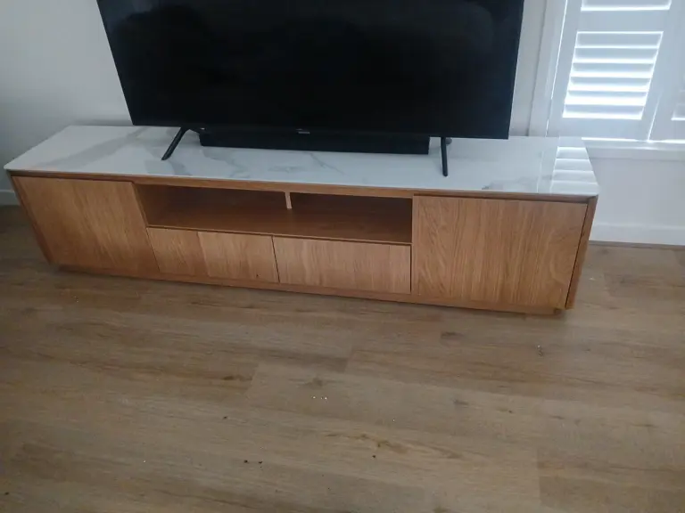 A TV unit delivered and positioned