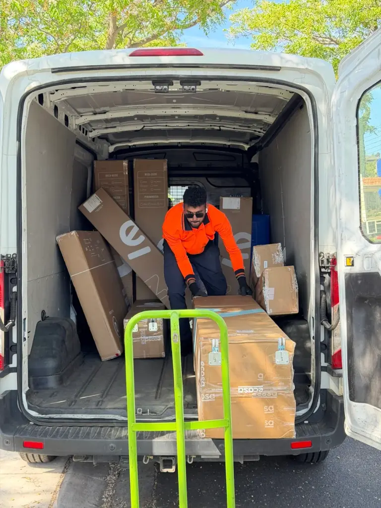 A van loaded with boxed furniture
