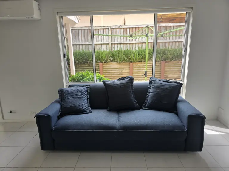 A sofa delivered into a living room
